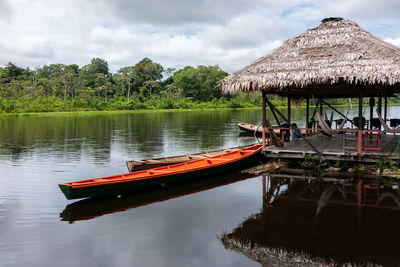 Boats in lake against sky