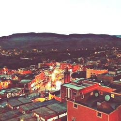 High angle view of illuminated cityscape against sky