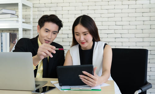 Business person brainstorming while sitting in office