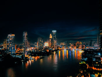 Illuminated buildings in city at night