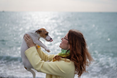 Side view of woman with dog