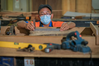 Carpenter working at workshop