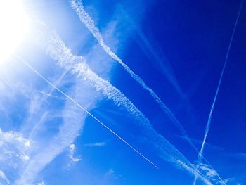 Low angle view of vapor trails in sky