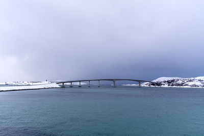 Sommaroy bridge scenic view of sea against clear sky