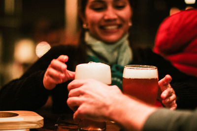 Friends sharing beer in a bar