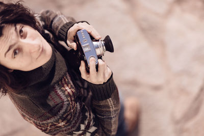 High angle portrait of man photographing