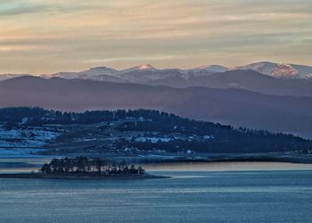 Scenic view of mountains against sky during winter