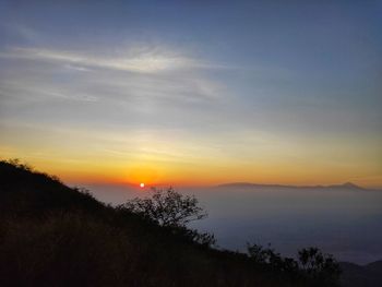 Scenic view of silhouette landscape against sky during sunset