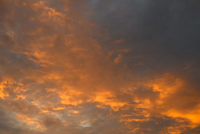 Low angle view of dramatic sky during sunset