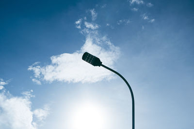 Low angle view of street light against sky