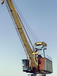 Crane against clear blue sky