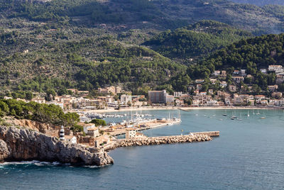 Aerial view of townscape by sea