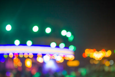Defocused image of illuminated lights at night