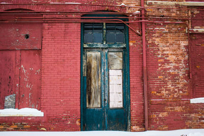 Wooden door and brick wall