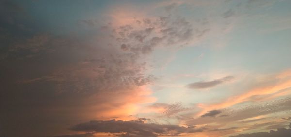 Low angle view of dramatic sky during sunset