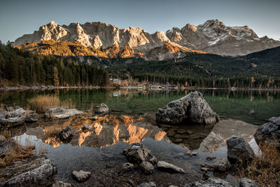 Scenic view of lake against sky during sunset