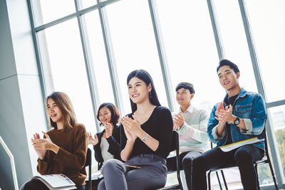 Group of people sitting in the window