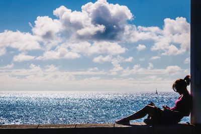 Scenic view of sea against cloudy sky