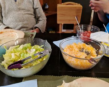 High angle view of woman preparing food on table