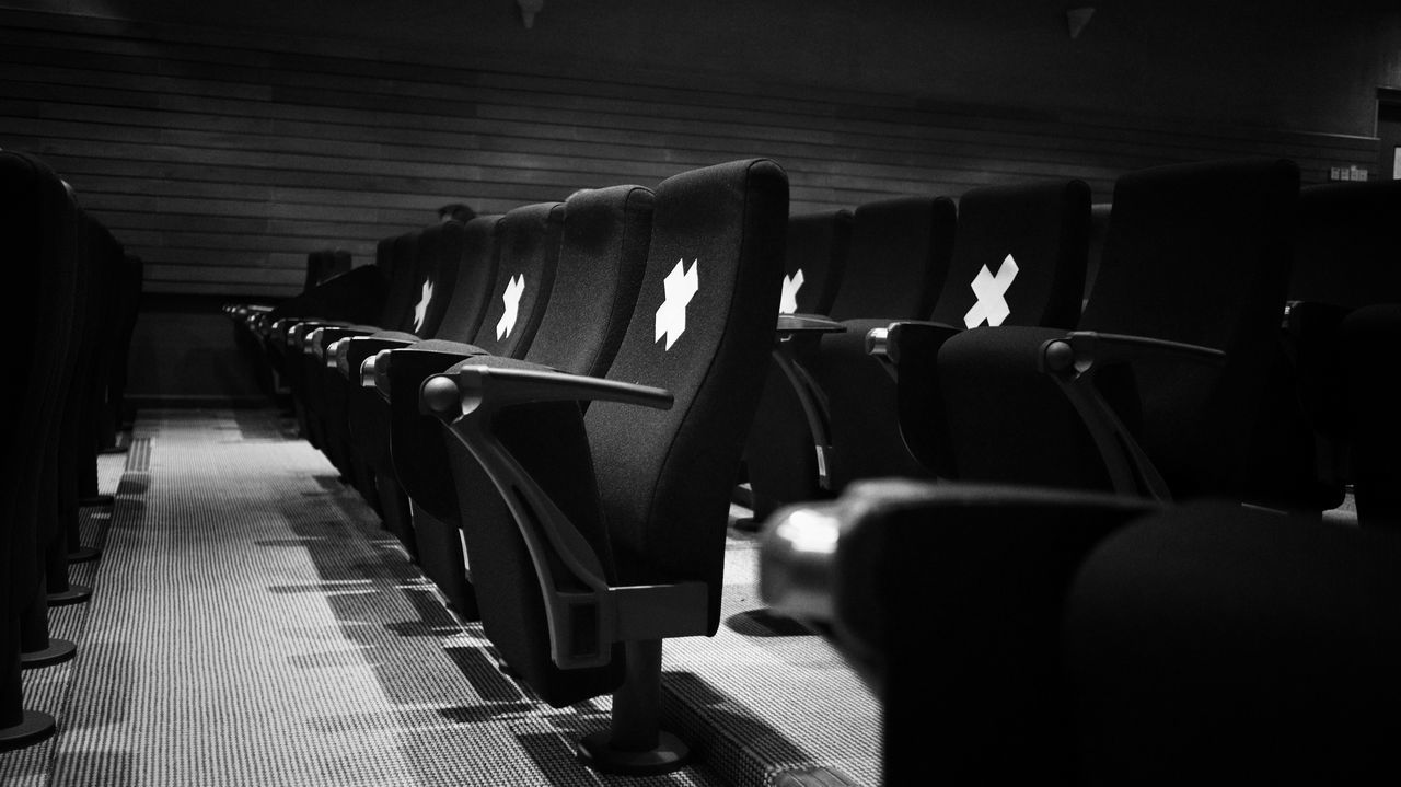 VIEW OF EMPTY CHAIRS IN ROW