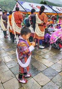 People standing in traditional clothing