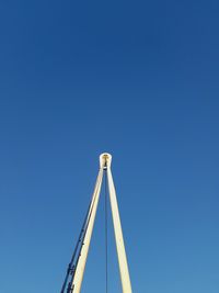 Low angle view of tower against clear blue sky