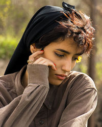 Portrait of young woman looking away