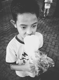 Portrait of boy holding outdoors