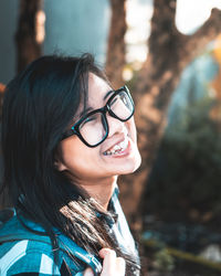 Close-up of smiling woman wearing eyeglasses 
