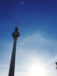 Low angle view of communications tower against sky