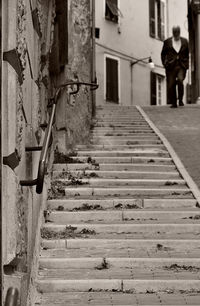 Woman walking on staircase