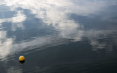 High angle view of balloons flying over water