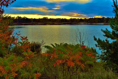 Scenic view of lake against sky during sunset