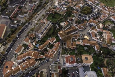 High angle view of street amidst buildings in town