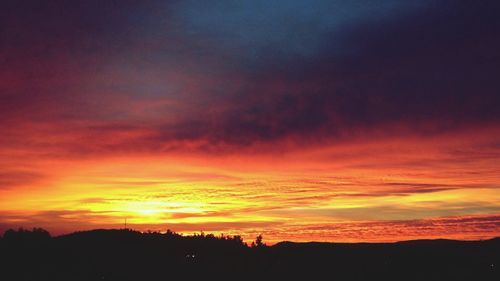 Silhouette of landscape against dramatic sky