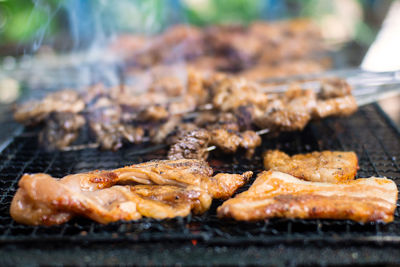 Close-up of meat on barbecue grill