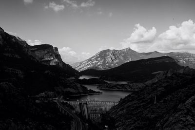 Scenic view of mountains against cloudy sky