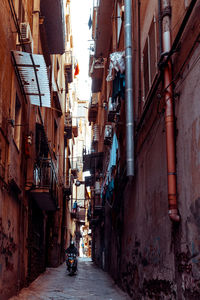 View of narrow street between old residential building