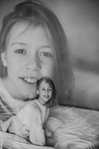 Portrait of cute girl sitting at home