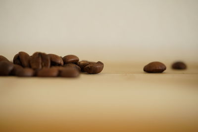 Close-up of coffee beans on table