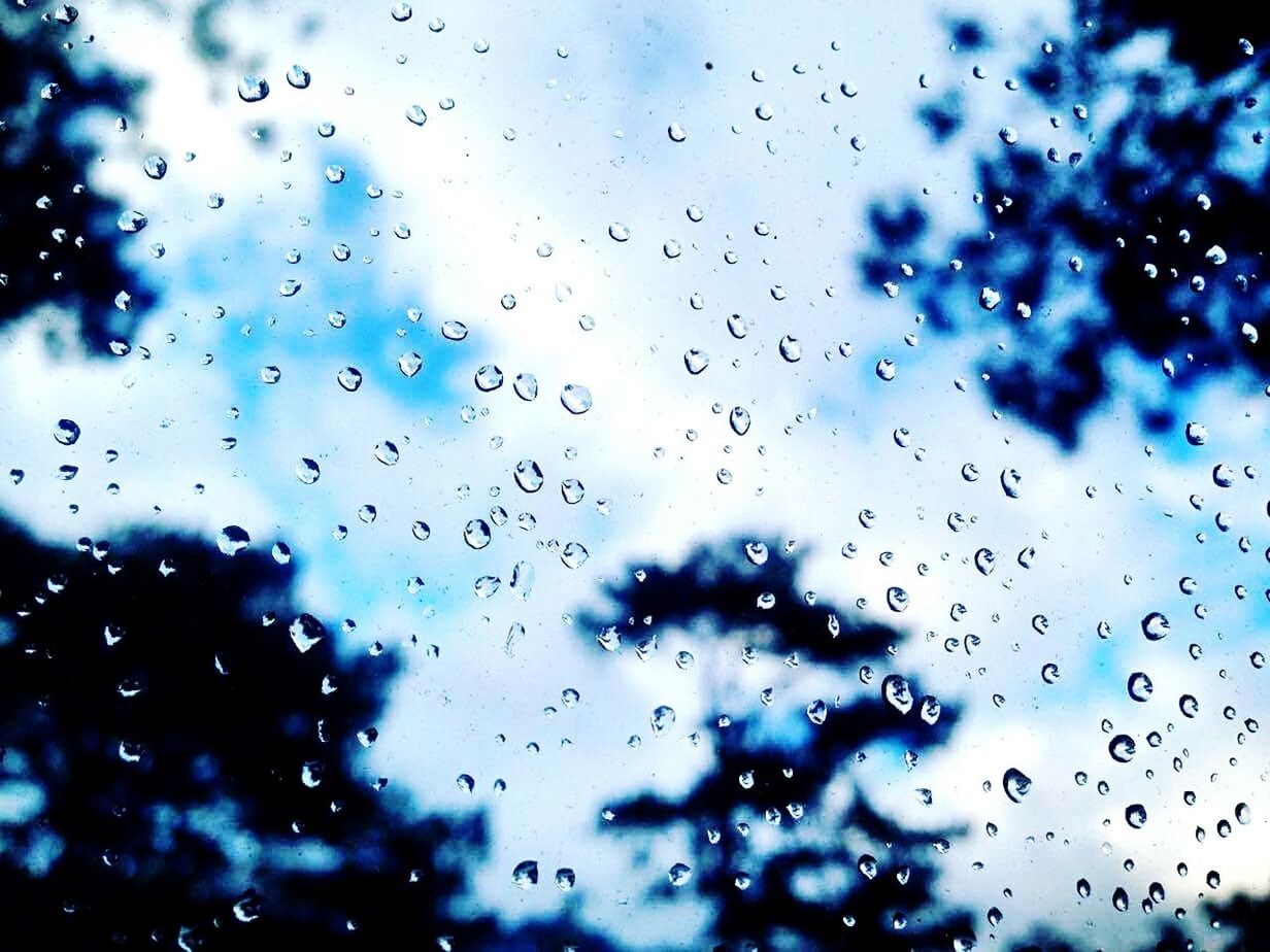 CLOSE-UP OF WINDOW AGAINST BLUE SKY