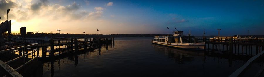 Built structure in water at sunset