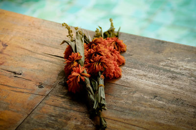 Close-up of wilted flower on table