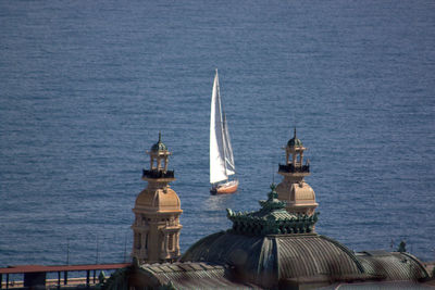 Sailboat in sea viewed from building