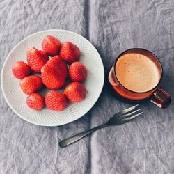 High angle view of strawberries on table