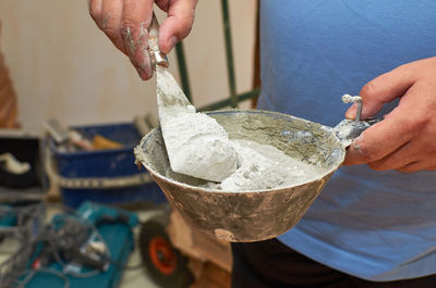 Midsection of man preparing food