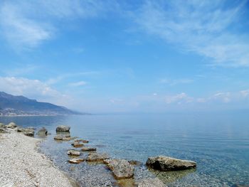 Scenic view of sea against cloudy sky