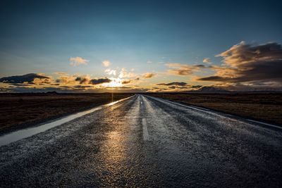 Road against sky during sunset