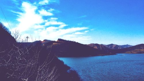 Scenic view of sea against blue sky