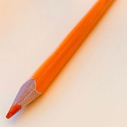 Close-up of colored pencils against white background